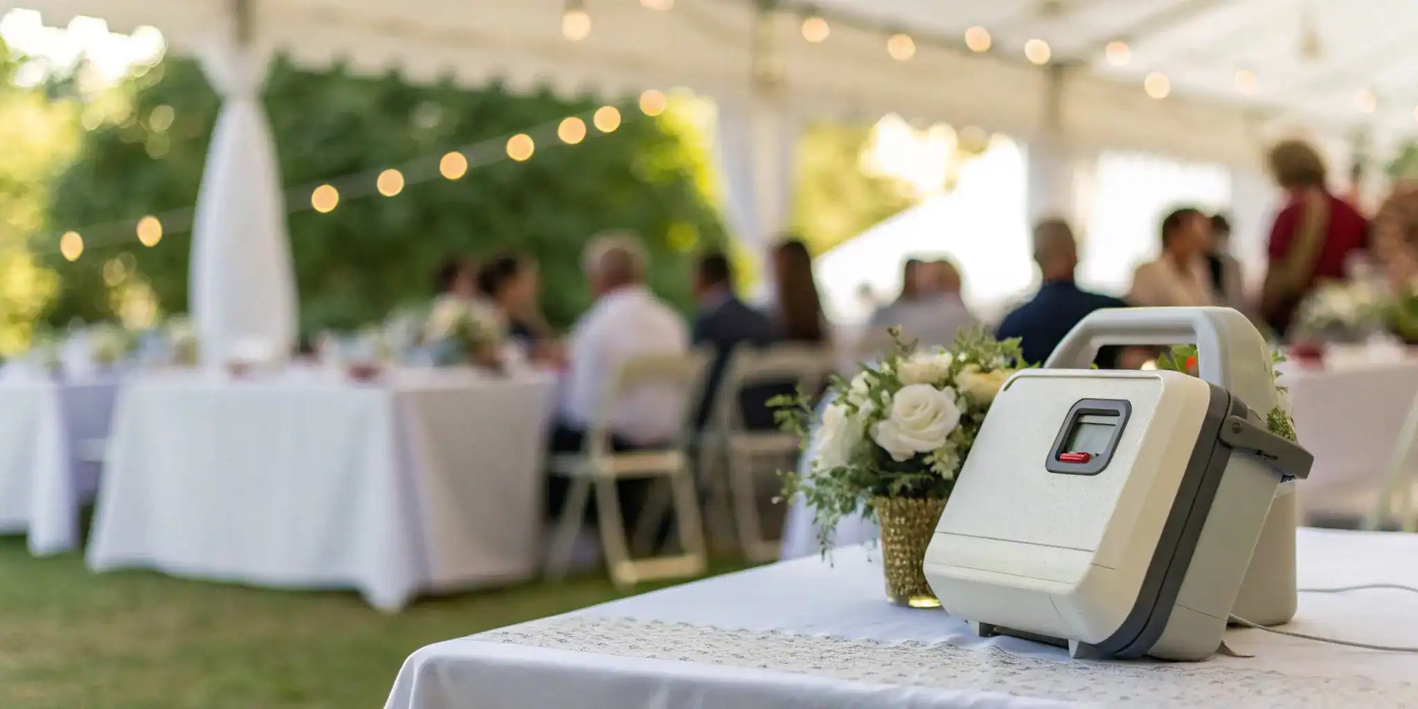 An AED rented for an event, set up on a table for easy access.