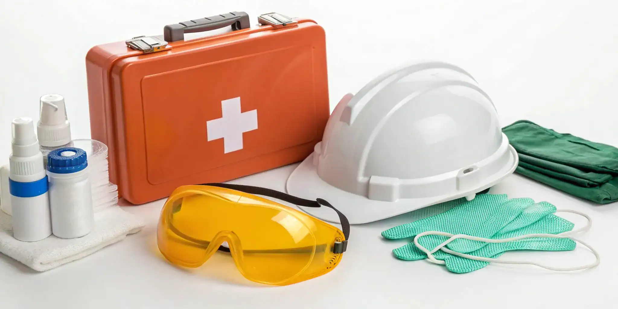 Workplace first aid certification course with a first aid kit and safety equipment.